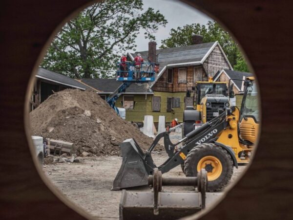 The Speedway courtyard construction site viewed through a hole in the interior wall